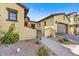 Tan stucco home with brick accents and a gated entryway at 3190 S Jacaranda Ct, Gold Canyon, AZ 85118