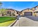 Beautiful two-story home with stone accents and a two-car garage at 3190 S Jacaranda Ct, Gold Canyon, AZ 85118