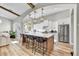 Modern kitchen with white cabinets, a large island and stainless steel appliances at 3190 S Jacaranda Ct, Gold Canyon, AZ 85118