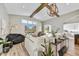 Spacious living area with hardwood floors and a large TV at 3190 S Jacaranda Ct, Gold Canyon, AZ 85118