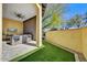 Outdoor patio with seating area and artificial turf at 3190 S Jacaranda Ct, Gold Canyon, AZ 85118