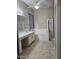 Bathroom with double sinks, soaking tub, and separate shower at 4072 S Skyline Ct, Gilbert, AZ 85297
