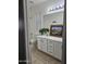 Clean bathroom with double vanity and tile floor at 4072 S Skyline Ct, Gilbert, AZ 85297