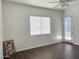 Bright bedroom with dark wood flooring and a window at 4072 S Skyline Ct, Gilbert, AZ 85297