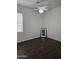 Simple bedroom with hardwood floors and ceiling fan at 4072 S Skyline Ct, Gilbert, AZ 85297