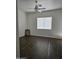 Bedroom with dark wood flooring and ceiling fan at 4072 S Skyline Ct, Gilbert, AZ 85297