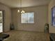 Dining room with tile floor and a chandelier at 4072 S Skyline Ct, Gilbert, AZ 85297