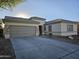 House exterior with gray garage door and stone accents at 4072 S Skyline Ct, Gilbert, AZ 85297
