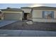 One-story home with attached garage and desert landscaping at 4072 S Skyline Ct, Gilbert, AZ 85297