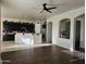 Kitchen boasts dark cabinetry, granite counters, and an island at 4072 S Skyline Ct, Gilbert, AZ 85297
