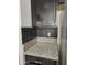 Kitchen detail showing granite countertop and dark cabinets at 4072 S Skyline Ct, Gilbert, AZ 85297
