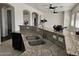 Kitchen island with granite countertop and double sinks at 4072 S Skyline Ct, Gilbert, AZ 85297