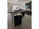 Kitchen island with granite countertops and double sink at 4072 S Skyline Ct, Gilbert, AZ 85297