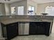 Kitchen with stainless steel dishwasher and granite countertops at 4072 S Skyline Ct, Gilbert, AZ 85297