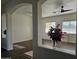 Living room with dark wood-look floors and arched entryway at 4072 S Skyline Ct, Gilbert, AZ 85297