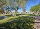 A park has a lake and a grassy area for people to enjoy at 4072 S Skyline Ct, Gilbert, AZ 85297