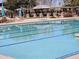 Sparkling community pool with lounge chairs and shaded seating areas at 4072 S Skyline Ct, Gilbert, AZ 85297
