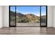 Bedroom with sliding doors showcasing mountain views at 4129 E Sandy Mountain Rd, Paradise Valley, AZ 85253