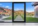 Glass doors open to a scenic mountain view at 4129 E Sandy Mountain Rd, Paradise Valley, AZ 85253