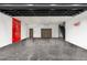 Spacious garage with polished concrete floor and Ferrari logo at 4129 E Sandy Mountain Rd, Paradise Valley, AZ 85253