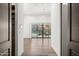 Hallway with wood floors and sliding glass doors to the pool and mountain views at 4129 E Sandy Mountain Rd, Paradise Valley, AZ 85253