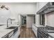 Modern kitchen with farmhouse sink, stainless steel range, and marble countertops at 4129 E Sandy Mountain Rd, Paradise Valley, AZ 85253