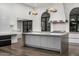 Spacious kitchen with modern island, stainless steel appliances, and marble countertops at 4129 E Sandy Mountain Rd, Paradise Valley, AZ 85253
