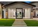 Modern kitchen visible through glass doors, showcasing sleek design and high-end appliances at 4129 E Sandy Mountain Rd, Paradise Valley, AZ 85253