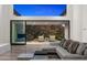 Living room with expansive windows showcasing scenic views and access to patio at 4129 E Sandy Mountain Rd, Paradise Valley, AZ 85253