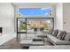 Living room with sectional sofa, stunning mountain views, and a modern fireplace at 4129 E Sandy Mountain Rd, Paradise Valley, AZ 85253
