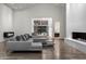 Spacious living room with gray sectional sofa and floor to ceiling windows at 4129 E Sandy Mountain Rd, Paradise Valley, AZ 85253