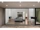 Open concept living area with gray sectional sofa and views of the backyard at 4129 E Sandy Mountain Rd, Paradise Valley, AZ 85253