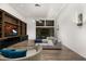 Modern media room featuring built-in shelving, large TV, and comfortable seating at 4129 E Sandy Mountain Rd, Paradise Valley, AZ 85253