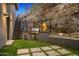 Outdoor kitchen and patio area nestled into the mountainside at 4129 E Sandy Mountain Rd, Paradise Valley, AZ 85253