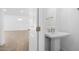 Half-bathroom with bright vanity, tile floors, and neutral paint at 42103 N Cutbow Trl, San Tan Valley, AZ 85140