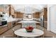 Open-concept kitchen featuring a center island, stainless steel appliances, and ample counter space at 42103 N Cutbow Trl, San Tan Valley, AZ 85140