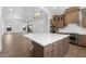 Spacious kitchen with a large center island, stainless steel appliances, and pendant lighting at 42103 N Cutbow Trl, San Tan Valley, AZ 85140