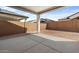 Covered patio with concrete flooring, and a view of the block wall fence at 42103 N Cutbow Trl, San Tan Valley, AZ 85140