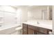 Clean bathroom with tub, shower, and vanity at 42835 W Peters Dr, Maricopa, AZ 85138