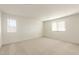 Well-lit bedroom with neutral walls and carpet at 42835 W Peters Dr, Maricopa, AZ 85138