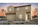 Two-story house with tan exterior, tile roof, and two-car garage at 42835 W Peters Dr, Maricopa, AZ 85138