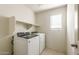 Bright laundry room with washer and dryer hookups at 42835 W Peters Dr, Maricopa, AZ 85138