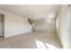 Living room with tile floors and stairs leading upstairs at 42835 W Peters Dr, Maricopa, AZ 85138