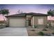 One-story home with attached garage and desert landscaping at 42850 W Peters Dr, Maricopa, AZ 85138