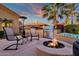 Cozy patio with fire pit, seating, and built-in BBQ at 4503 E Cabrillo Dr, Gilbert, AZ 85297