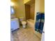 Bathroom with a bathtub, toilet, and vanity at 5019 W Roma Ave, Phoenix, AZ 85031