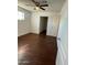 Bedroom with dark hardwood floors and a closet at 5019 W Roma Ave, Phoenix, AZ 85031