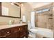 Bathroom with tub, shower, and granite vanity at 5648 W Folley St, Chandler, AZ 85226