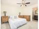 Spacious bedroom with ceiling fan and ensuite access at 5648 W Folley St, Chandler, AZ 85226