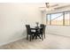 Small dining area with black table and four chairs at 5648 W Folley St, Chandler, AZ 85226